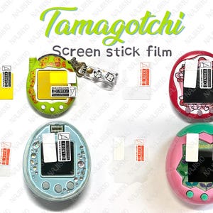 May include: A selection of Tamagotchi screen protectors and devices. The image shows several Tamagotchi devices in various colours, including green, red, blue, and pink, alongside screen protector films. The text "Tamagotchi" and "Screen stick film" are visible.