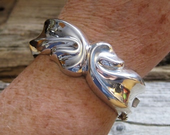 1" wide HINGED BANGLE BRACELET, chunky sturdy sterling in ribbon motif. Will fit 7 1/4 or smaller wrist. Quality everyday signature piece.