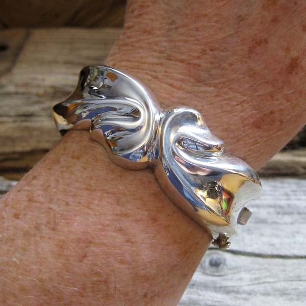 1" wide HINGED BANGLE BRACELET, chunky sturdy sterling in ribbon motif. Will fit 7 1/4 or smaller wrist. Quality everyday signature piece.