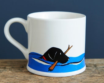 Swimming Black Labrador mug