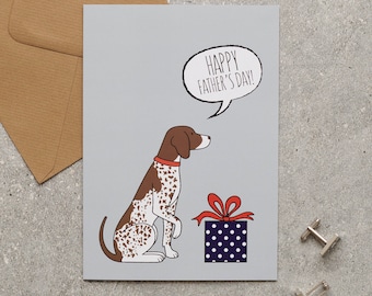 May include: A Father's Day card featuring a cartoon dog with brown and white spots, a red collar, and a speech bubble that says "Happy Father's Day!". The dog sits next to a blue gift box with white polka dots and a red bow.