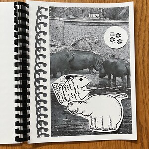 May include: A black and white photo of a notebook page with a black and white drawing of a hippopotamus, a fish, and ladybugs. The text "x-ray tetra fish" and "hippo" are written on the page.