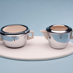 Heatmaster Chrome-encased Creamer/sugar by Ellgreave Pottery of Burslem, England, 1950