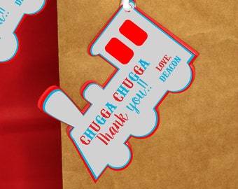 May include: A set of three train-shaped thank you tags with red, white, and blue accents. The tags feature the text "Chugga Chugga Thank You!" and "Love, Deacon".