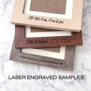 May include: Three rectangular wooden picture frames with laser-engraved text. The top frame is light wood with "All that I am, I owe to you." The middle frame is dark wood with "Luke Richard, May 17, 2022, 8 lb 5 oz | 19 inches." The bottom is grey wood with "True friendship knows no distance" and a heart icon.