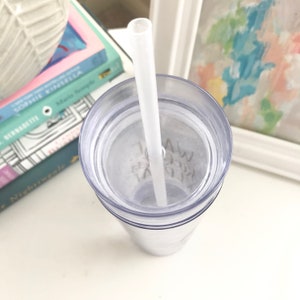 May include: A clear plastic tumbler with a lid and a white straw. The tumbler has a handwritten message on the inside that says "Take a break".