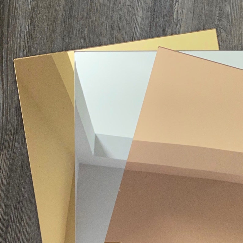 May include: Three sheets of mirrored acrylic in gold, silver and rose gold.