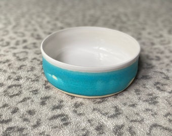 White and turquoise glazed serving bowl