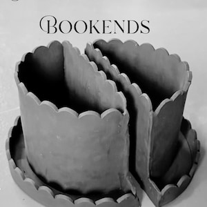 May include: A grayscale image of a scallop-edged planter and bookends. The planter and bookends are made of a solid material and have a scalloped edge design. The text "SCALLOP PLANTER BOOKENDS Printable PDF" is displayed at the top and bottom of the image.
