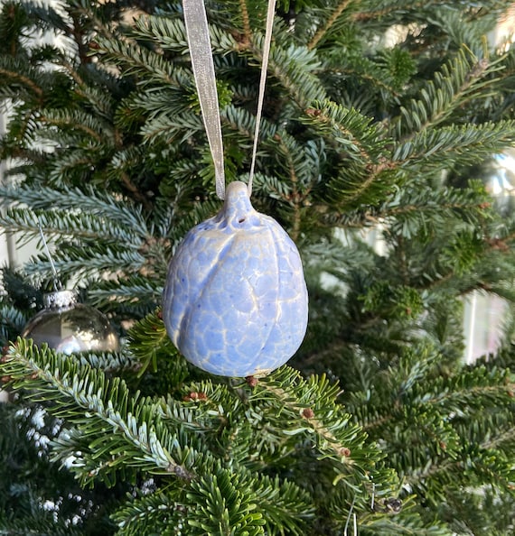 Wheel thrown Christmas tree ornament with purple crackle glaze