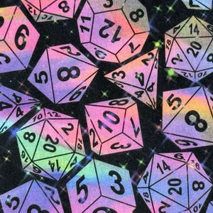 May include: A black background with iridescent rainbow dice with different numbers on each side. The dice are scattered randomly across the background.