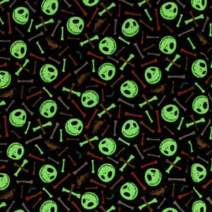 May include: A black background with a repeating pattern of green Jack Skellington faces and colorful bones.