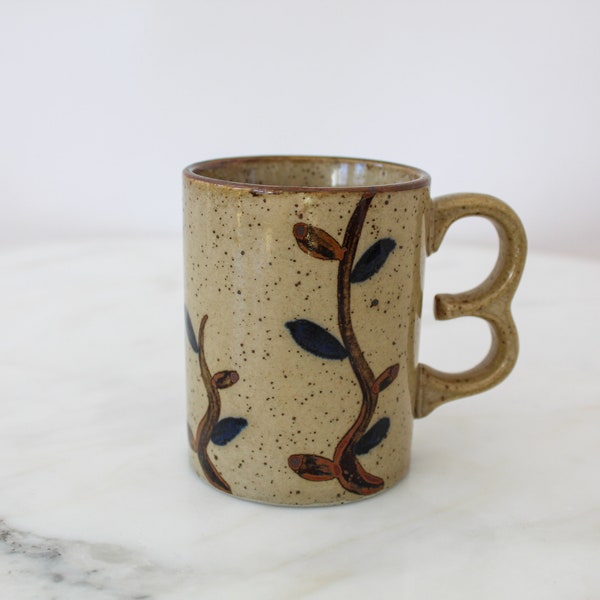 speckled stoneware mug / hand-painted leaves / finger handle