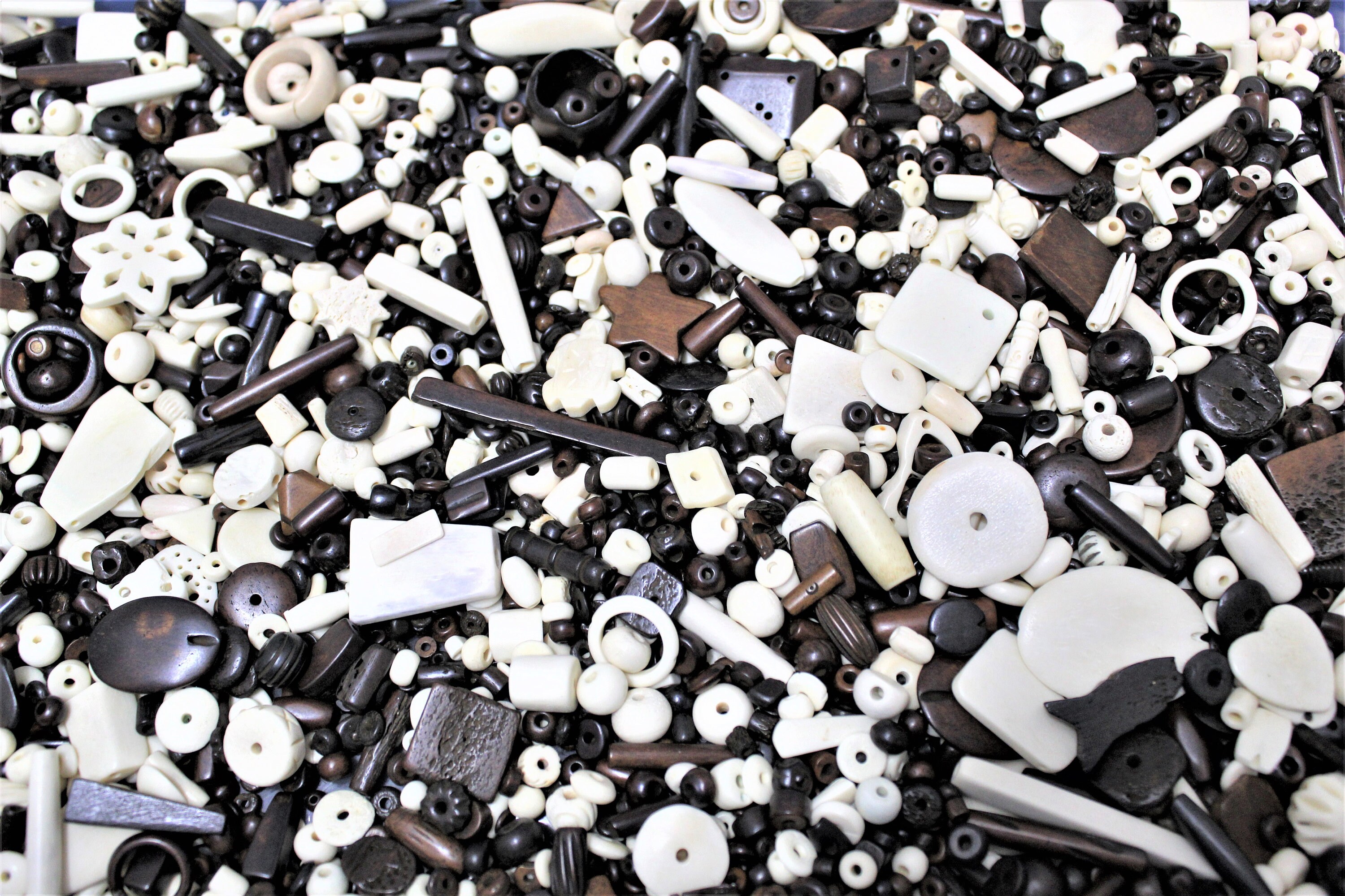 Assorted Colors, Sizes and Shapes of Buffalo Bone Beads by the Ounce