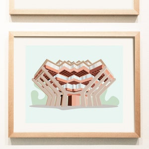 May include: A framed illustration of a pink and beige building with a unique architectural design. The building has multiple levels and appears to be supported by a series of columns.