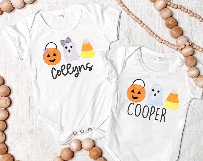 Halloween Baby Outfit for Boy or Girl with personalized name and graphics of jack-o-lantern pumpkin trick or treat bucket ghost & candy corn