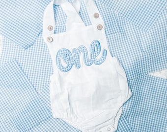 First birthday outfit for baby boy - white bubble romper with blue gingham embroidered “one” appliqué