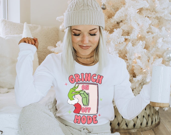 Christmas Mode On Long sleeve tee shirt with green hand switching light switch on in red green and pink coloring