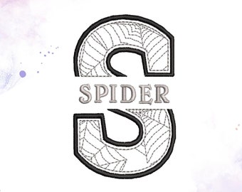 May include: Black and white spiderweb design with the letter "S" in the center and the word "SPIDER" written across the middle.