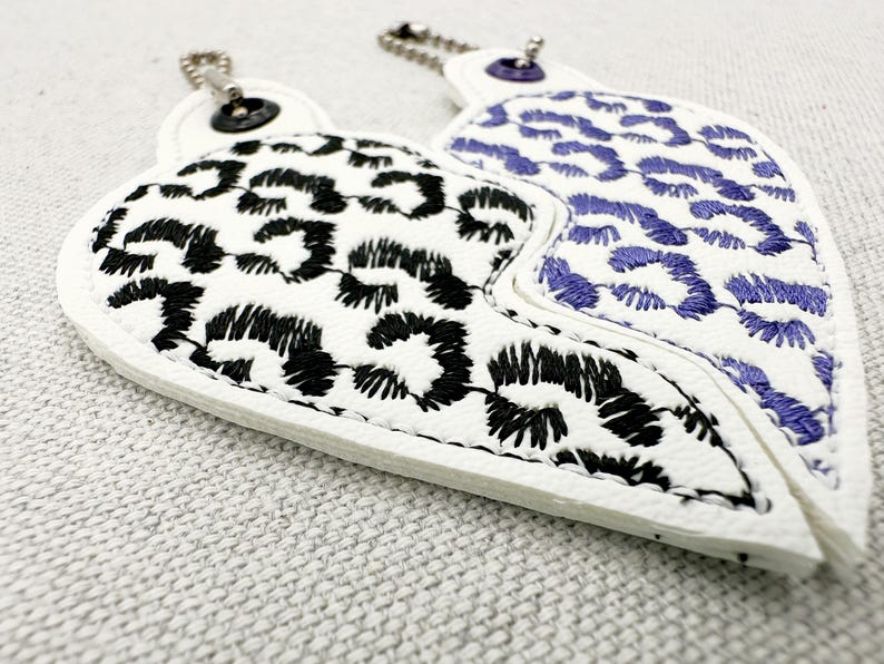 Leopard print Split Heart Eyelet and Key Fob Snap Tab keychain in the shown on fabric Instant Download By Fonts Heaven Embroidery Format PES HUS DST JEF EXP VP3 XXX EXP