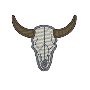 May include: A white bull skull with brown horns. The skull is embroidered with a textured pattern.