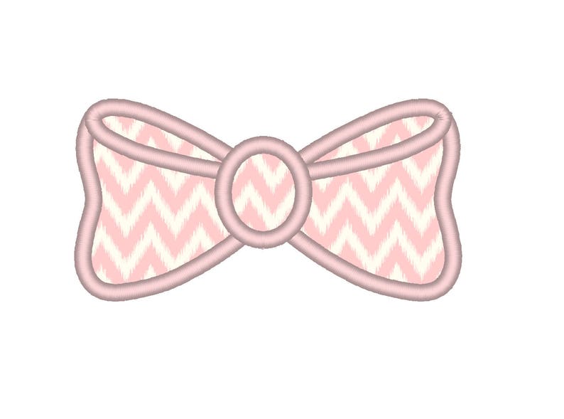 May include: A pink bow with a chevron pattern and a pink circle in the center.