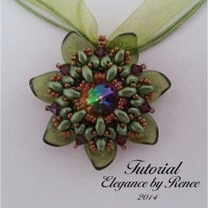 May include: A green beaded flower pendant with a clear iridescent crystal in the center. The pendant is on a green ribbon.