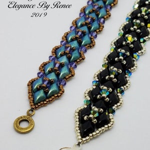 May include: Two beaded bracelets with silver clasps. One bracelet is made with black and silver beads, the other with blue, purple, and copper beads. The bracelets are labeled "Little Gem Bracelet Elegance By Renee 2019".