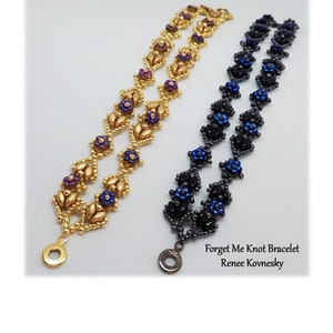 May include: Two beaded bracelets with a forget-me-not flower design. One bracelet is gold with purple flowers and the other is black with blue flowers. The bracelets are called "Forget Me Knot Bracelet" by Renee Kovnesky.
