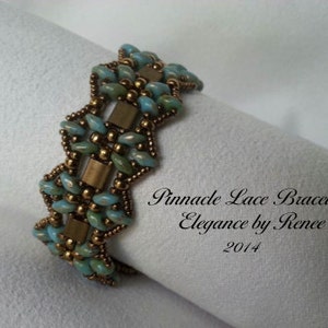 May include: A turquoise and gold beaded bracelet with a geometric pattern. The bracelet is called "Pinnacle Lace Bracelet Elegance by Rence 2014".