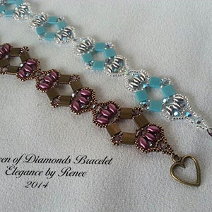 May include: Two beaded bracelets. One is brown and pink with a heart charm, the other is blue and silver. The bracelets are labelled "Queen of Diamonds Bracelet" and "Elegance by Renee 2014".