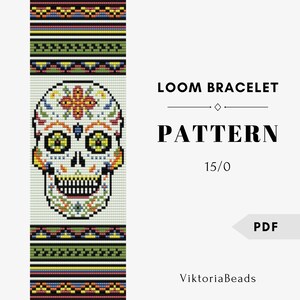 May include: A loom bracelet pattern featuring a colorful sugar skull design. The skull is white with yellow, orange, blue, and green accents. The pattern includes the text "LOOM BRACELET PATTERN 15/0" and "PDF".