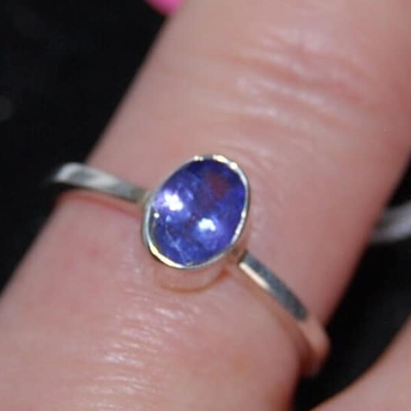 Pretty little Tanzanite clear stone and silver ring. Simple design, lovely colour stone, Ideal for every day. Gift for teenager or yourself?