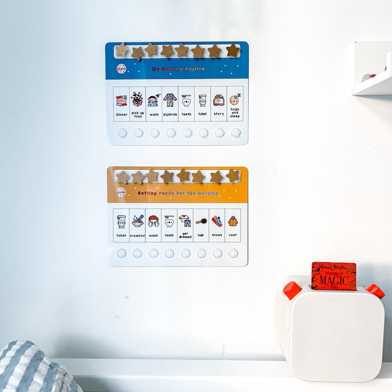 May include: Two chore charts with star-shaped magnets. The top chart reads "My Bedtime Routine" and the bottom chart reads "Getting ready for the morning." Each chart has illustrated tasks and spaces for stars.
