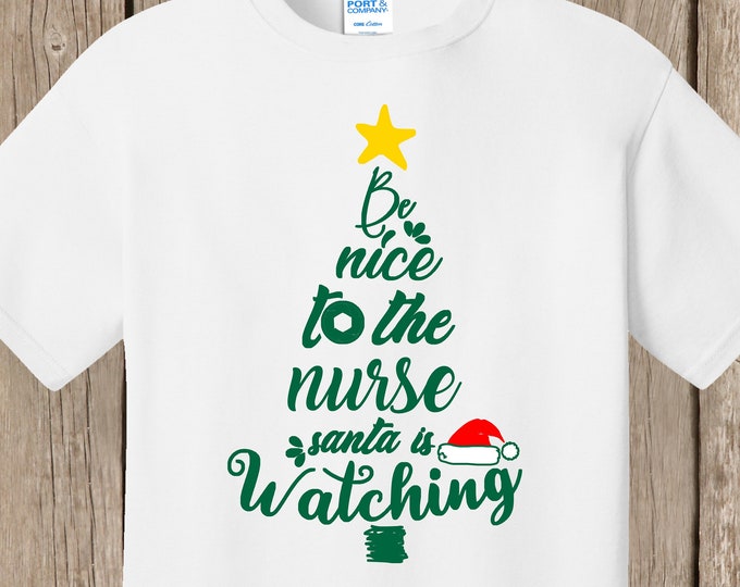 Nurse Christmas white T Shirt.  Be nice to the nurse.  Santa is watching.
