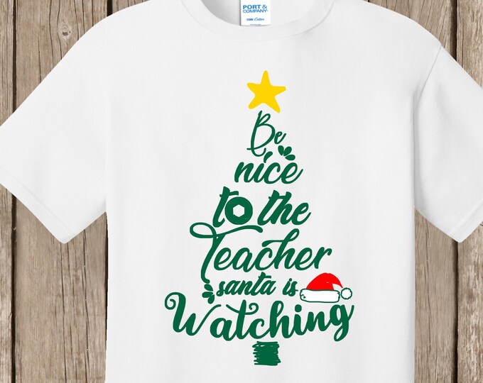 Teacher Christmas white T Shirt.  Be nice to the teacher.  Santa is watching.