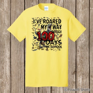 100th Day of School T Shirt 100 dinosaurs I've roared my way through 100 days of school Ships very quickly Now in gray, white, sand,red Yellow