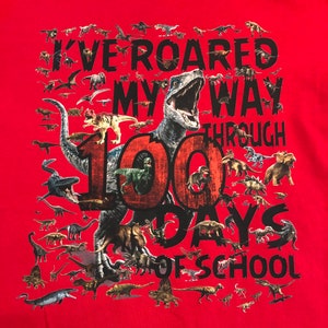 100th Day of School T Shirt 100 dinosaurs I've roared my way through 100 days of school Ships very quickly Now in gray, white, sand,red Red