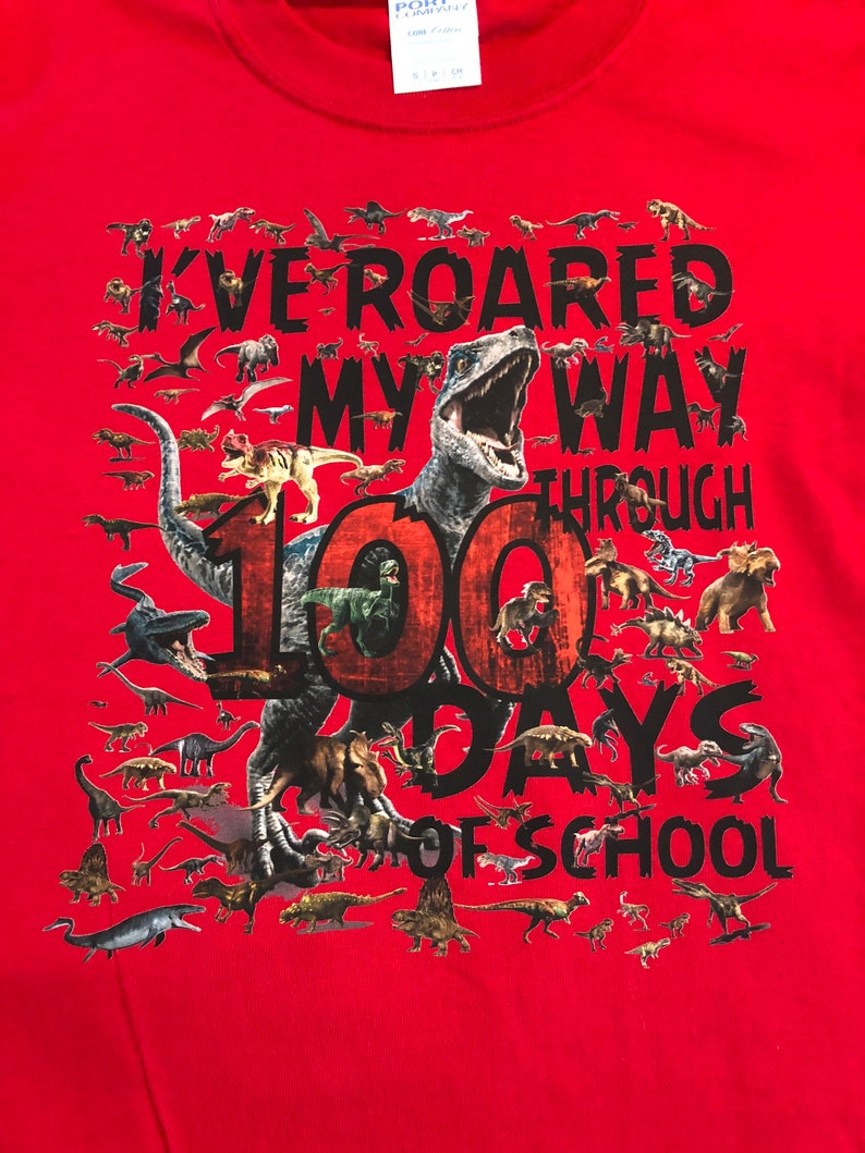 100th Day of School T Shirt 100 dinosaurs I've roared my way through 100 days of school Ships very quickly Now in gray, white, sand,red Red