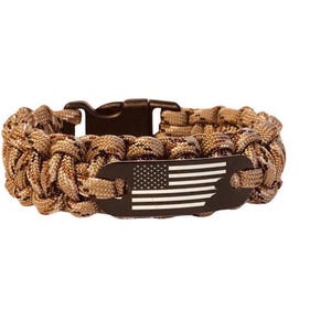 May include: A brown camouflage paracord bracelet with a black metal tag featuring a white American flag.