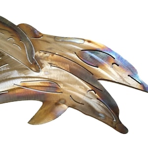 May include: Two metal dolphins leaping out of the water, with a brushed metal finish and iridescent highlights.
