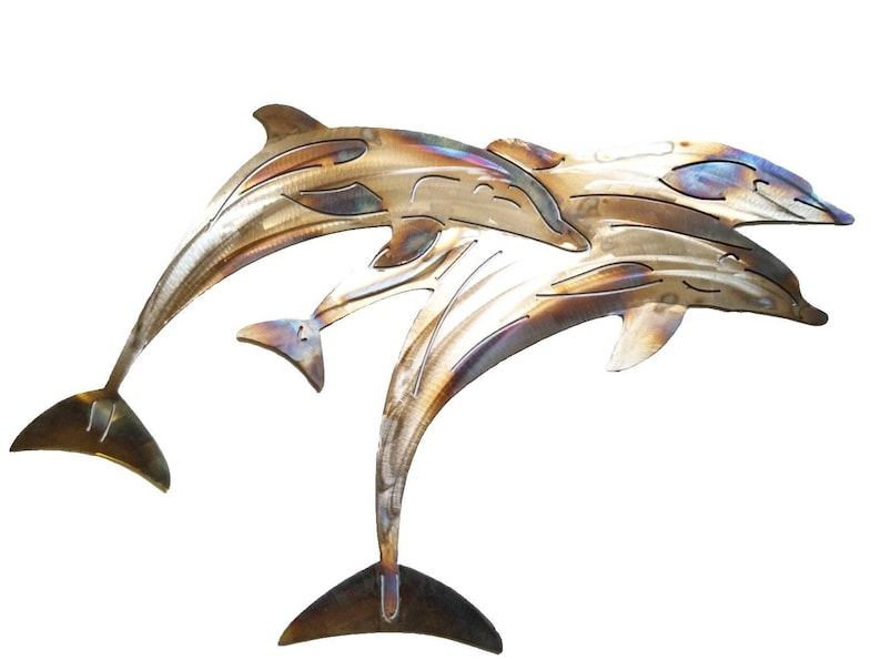 May include: Two metal dolphins leaping in mid-air, with a brushed finish that shows off the metal's natural color variations. The dolphins are facing the same direction, with the smaller dolphin leaping over the larger one.