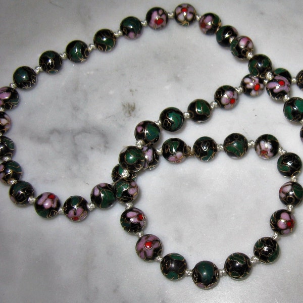 Vintage strand of individually knotted graduated 22" long Chinese Cloisonné Beads, Black Ground with floral Motif