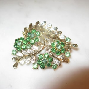 1960&#39;s Rhinestone Brooch, Prong set rhinestones in shades of green on a gold metal frame, Vintage Pin, 2.5&quot; x 1 1/4&quot;