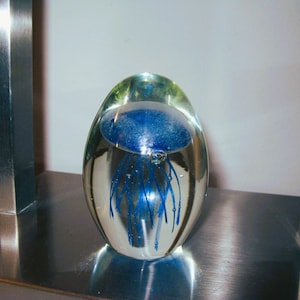 Dynasty Glass Egg Shape Paperweight with blue Jellyfish, Hand Blown glass paperweight.