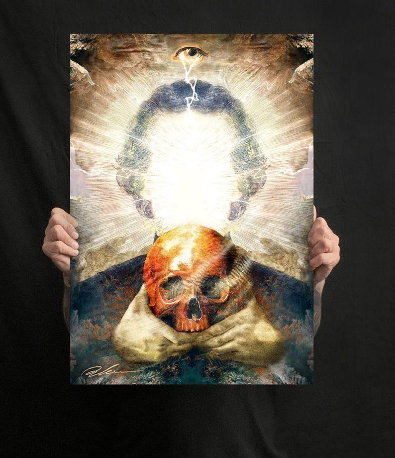 May include: A rectangular art print featuring a central orange skull held by two hands. Above the skull, a bright white light radiates outwards, topped by a single eye with lightning bolts. The background displays dark, textured, and cloudy patterns.
