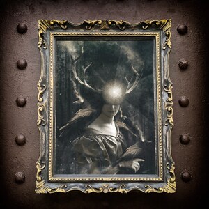 May include: A rectangular wall art print in an ornate, distressed black and gold frame. The artwork depicts a figure with large deer antlers and a glowing, circular light source over their eyes, accompanied by two dark birds in a forest.