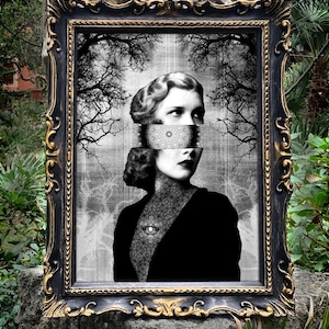 May include: A framed surrealist art print featuring a black and white portrait of a person with a segmented face, a circular mandala-like pattern over the eyes, and a single eye graphic on the chest, set against a background of dark tree silhouettes.