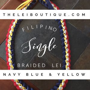 May include: A single braided lei made with navy blue, yellow, white, and red ribbon. The lei is a traditional Hawaiian garland worn around the neck. The lei is made with a single braid of ribbon, and the colors are arranged in a repeating pattern. The lei is a beautiful and festive decoration that can be used for a variety of occasions.