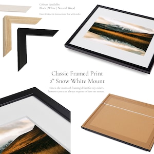 May include: A framed print with a landscape image, featuring a black frame and a white mount. The image shows a mountain range reflected in water. The text reads "Classic Framed Print" and "2" Snow White Mount".